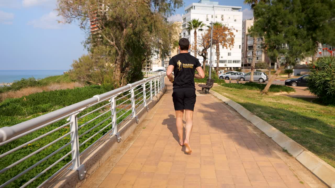 Barefooted male on cardio workout on warm Summer&rsquo;s day