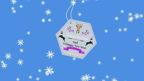 Animation-of-christmas-greetings-on-tag-over-snow-falling-on-blue-background