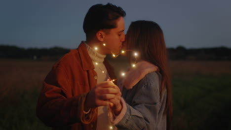 couple kissing outdoors in nature for valentine day