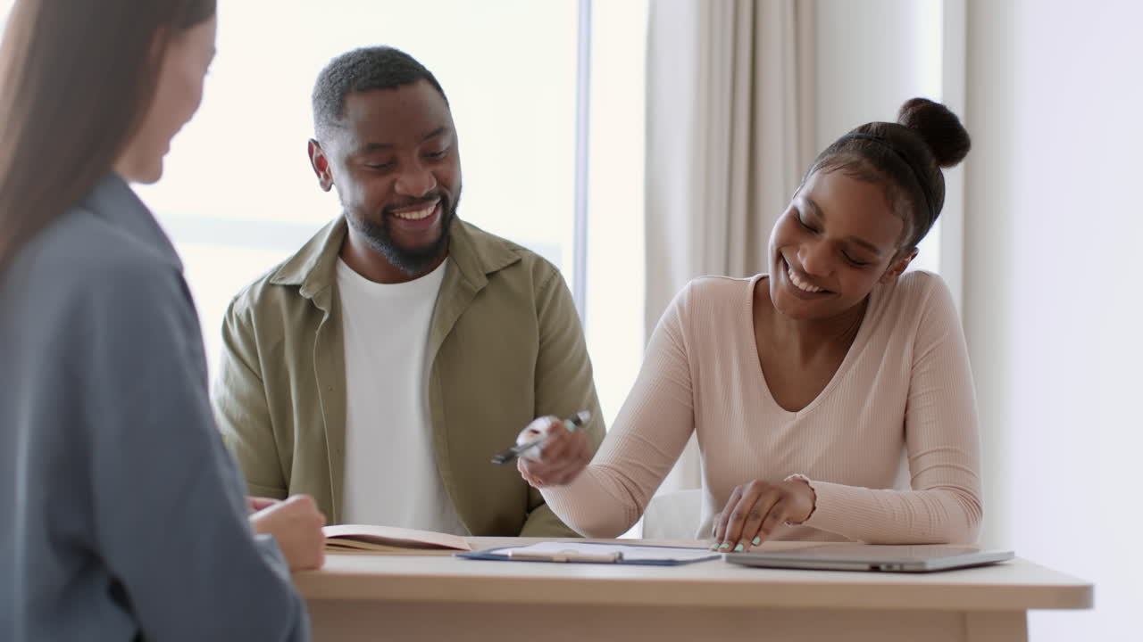 Couple Signing Contract