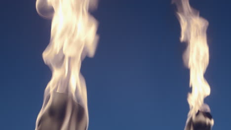 Ancient-style-torches-with-fire-in-a-bluescreen-backdrop