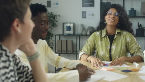 woman holding business meeting with creative team