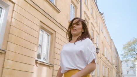 beautiful woman dancing latin dance alone in the old town street 2