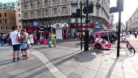 people and vehicles on a bustling city street