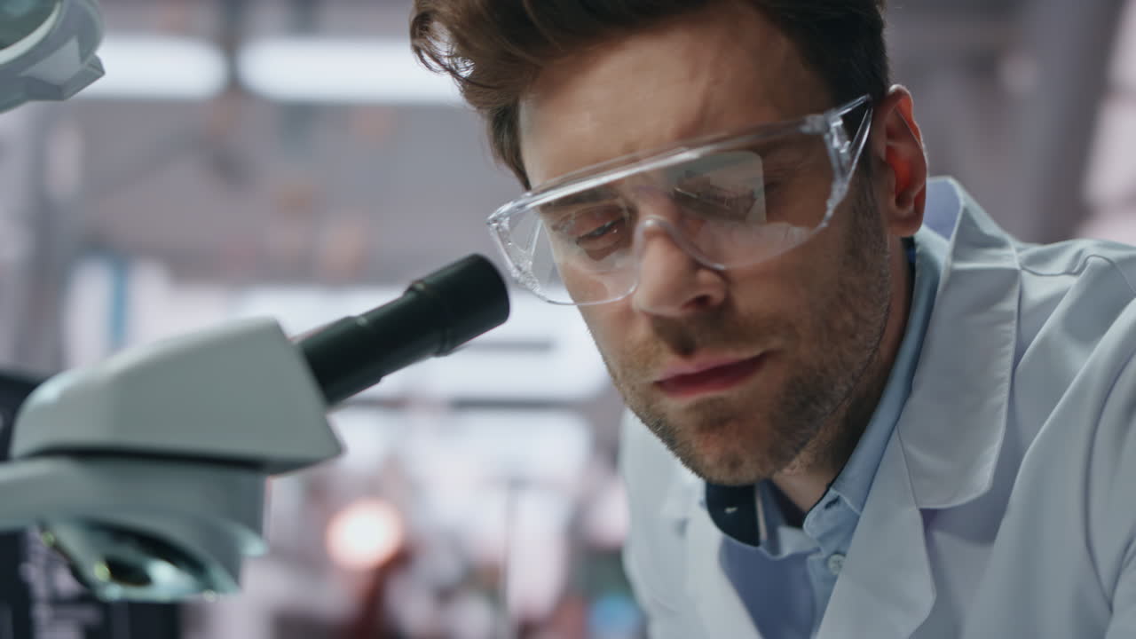 Closeup scientist investigate drugs in innovation laboratory. Researcher smiling