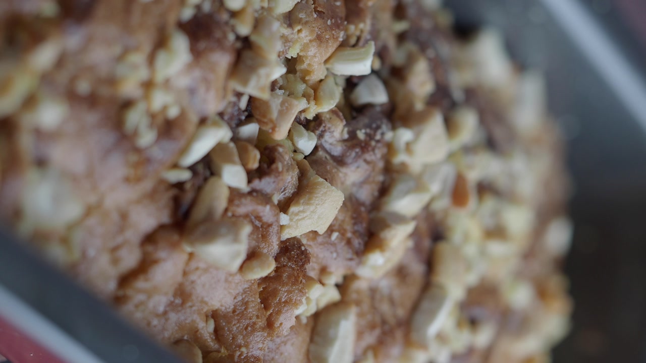 Macro Shot of a Golden Brown Cake with Chopped Nuts
