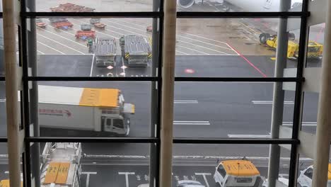 timelapse of vehicles moving on airport tarmac