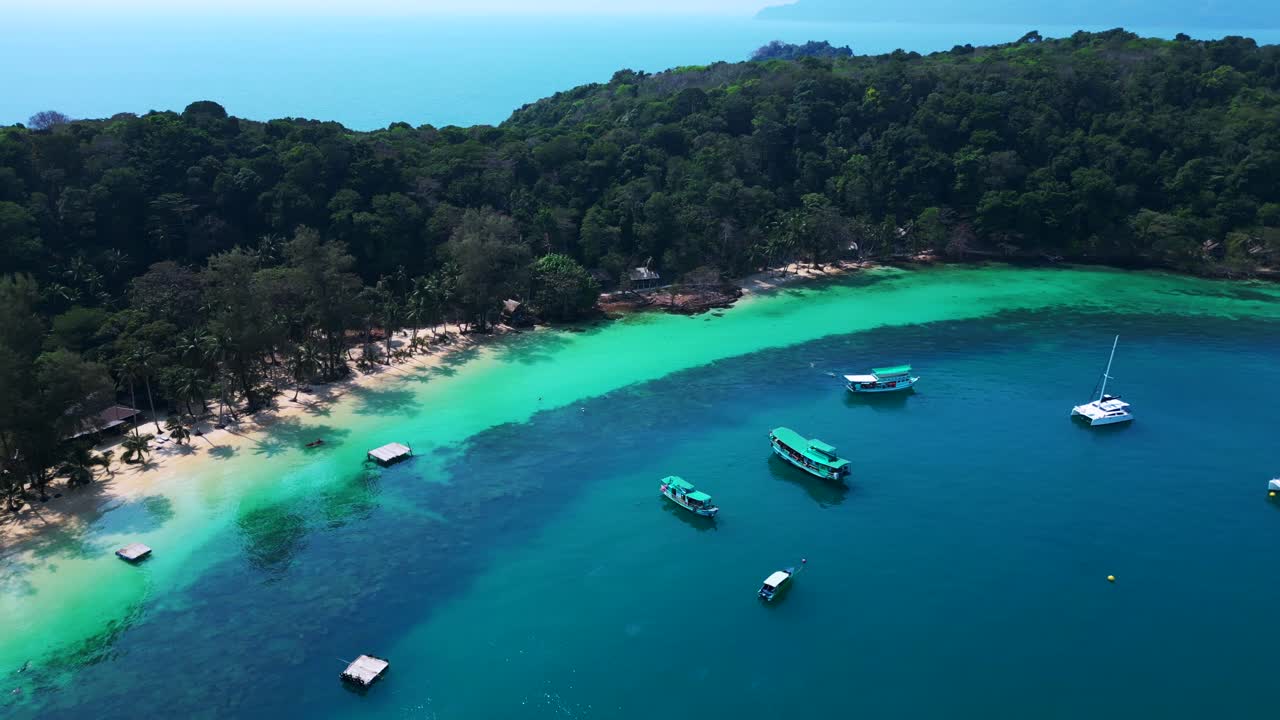 Koh Wai Bay Beach with boats anchored in turquoise waters. Unique aerial view flight panorama overview drone