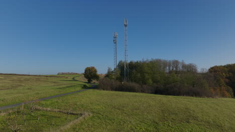 cellular towers in france countryside, aerial dolly push in