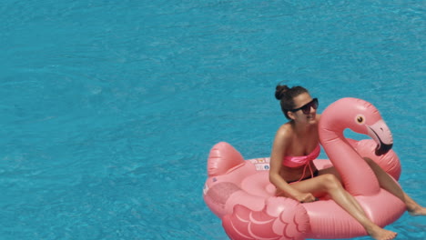 woman swimming on a blue water pool