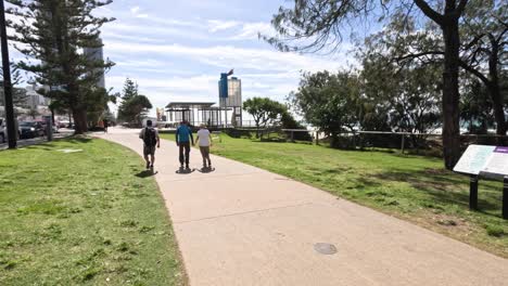 people walking and biking on a sunny day