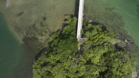 aerial - bridge of the islands of samana, dominican republic, top down tilt up reveal