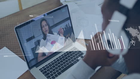 presenting data with graphs overlaying scene, businesswoman using laptop in office
