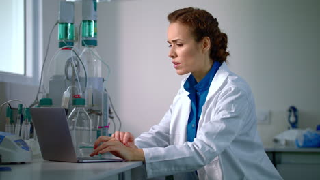 scientist working with modern laboratory equipment in lab. researcher in lab.