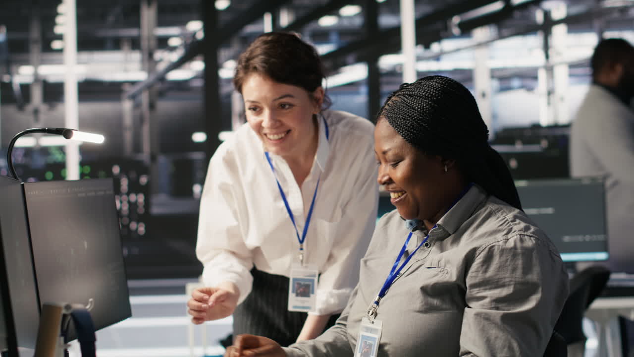 Vertical video Cheerful data center technicians collaborating on AI automation deployment
