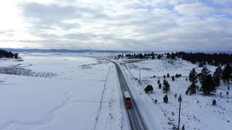 big rig on the snowy road to seneca, oregon