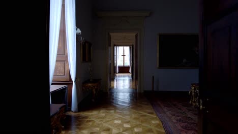 passage through a long corridor through several rooms in the manor house