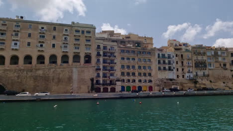 view of the old buildings above the quay wall of valetta on the island of malta