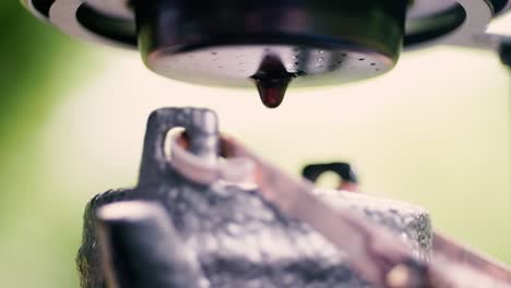 slow dripping coffee in a traditional aluminum vietnamese coffee maker