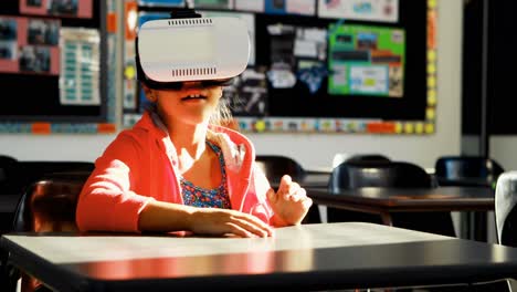 schoolgirl using virtual reality headset in classroom 4k