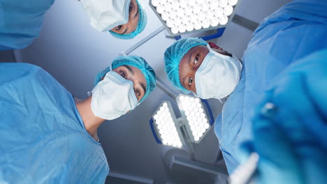 Doctor,-team-and-surgery-pov-in-a-medical-theatre