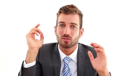 serious businessman talking to camera