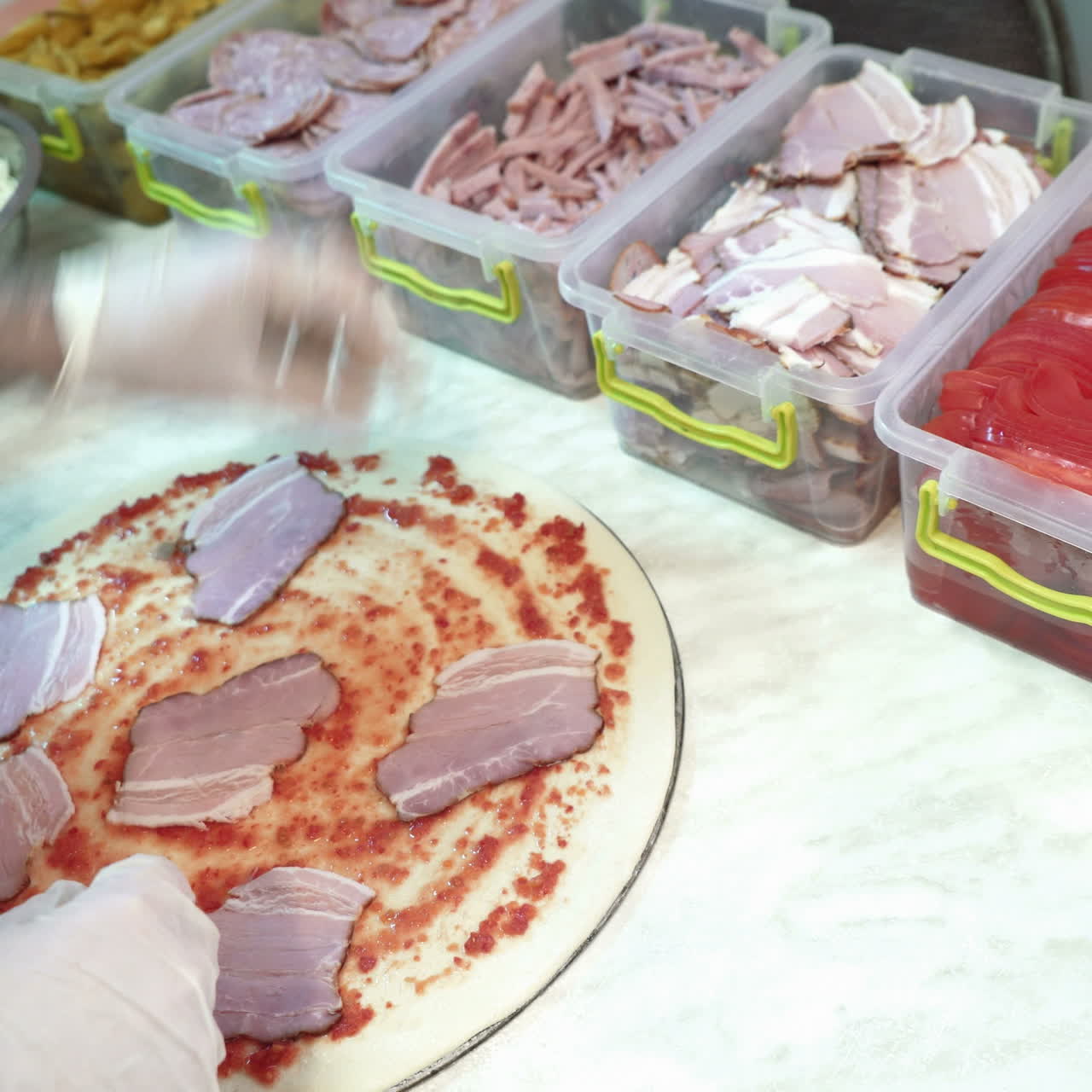 Skillful chef preparing a pizza. Hands of man in action Sqare video