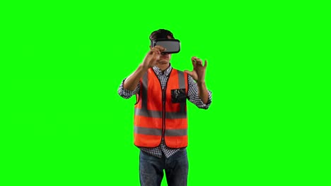 front view of a site worker using virtual reality with green screen