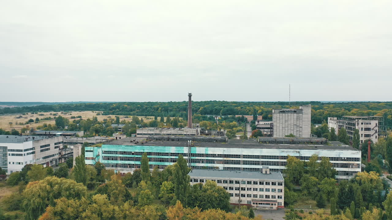 Aerial view of factory constructions. Industrial big destroted factory.