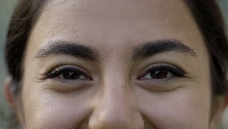 closeup shot of young woman with brown eyes.