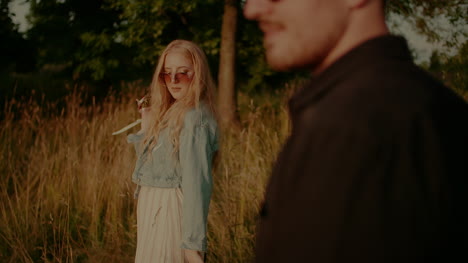 Joyful-Couple-Embracing-And-Smiling-Outdoors-In-Summer