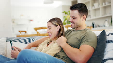 Tablet,-happy-and-couple-talking-on-sofa-in-living