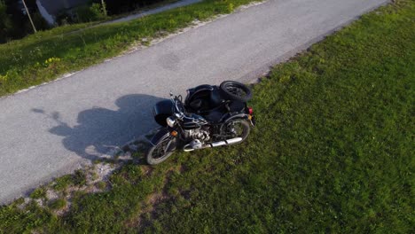 Zoom-out-aerial---black-vintage-Ural-motorcycle