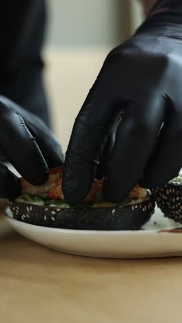 chef preparing gourmet shrimp burgers