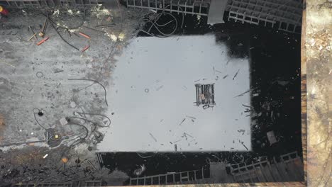 aerial view of a derelict ship undergoing demolition