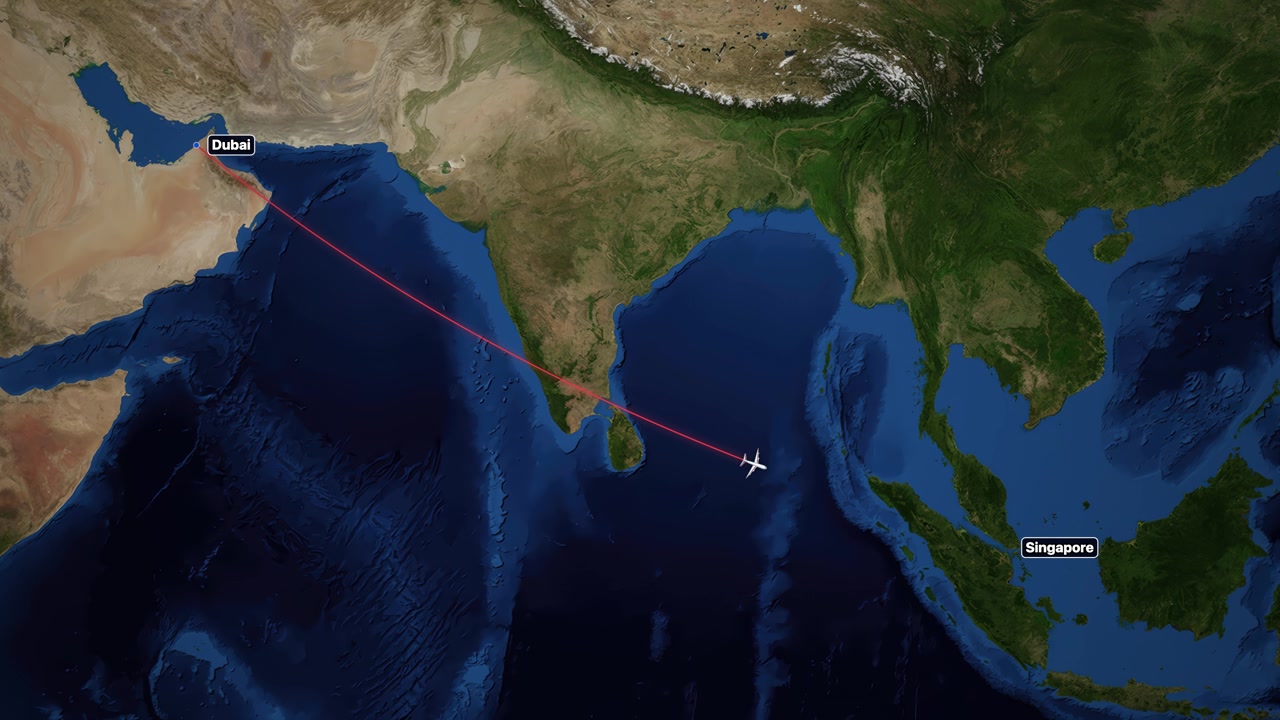 Satellite map animation tracks a plane flying from Dubai to Singapore across the Indian Ocean