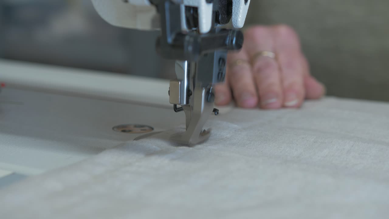 Sewing ends of curtains running fabric through sewing machine