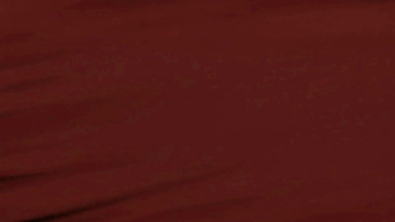 Abstract Red Fabric Moving in Dark Environment