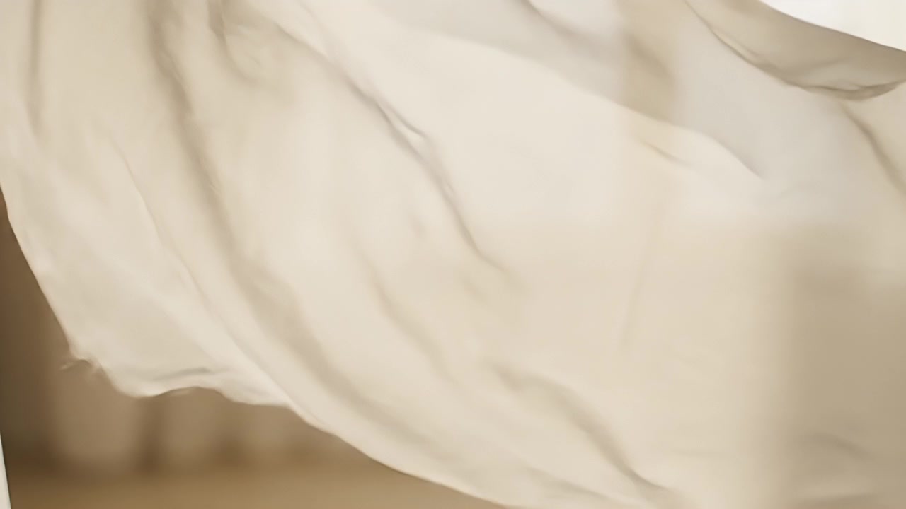 White Fabric Curtains Blowing in the Wind