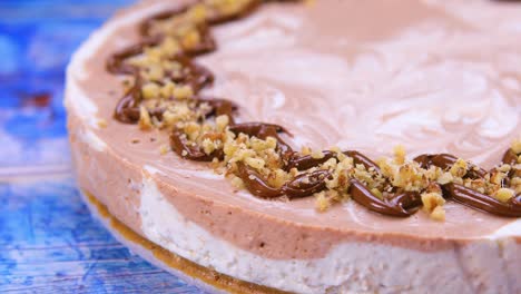 chocolate cheesecake decorated with walnuts