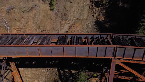 ladner creek trestle bridge from an aerial drone panning across rustic old crossing