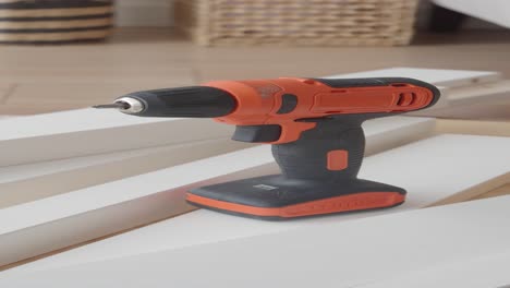 using a drill to assemble furniture