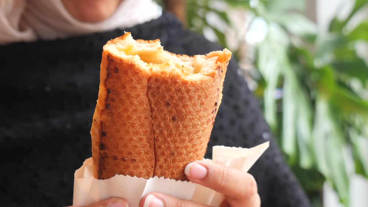 Sandwich being held in hand