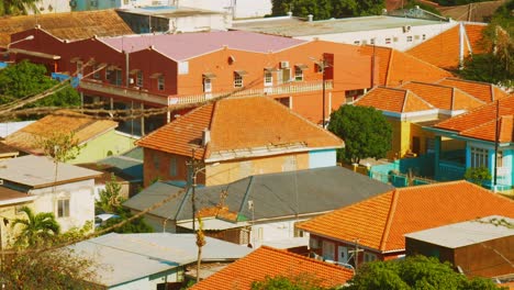 red tiled rooftops of houses and buildings in willemstad, curacao on a sunny day