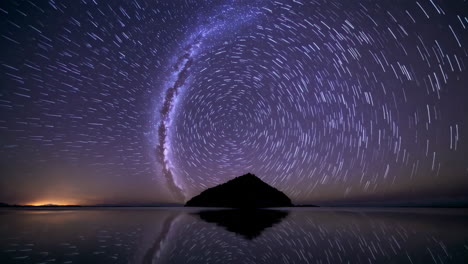 star trails over island reflection