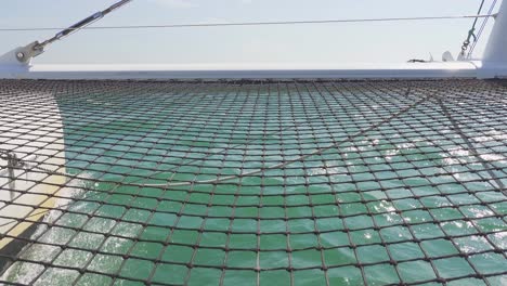 catamaran hull and water splashing, safety net