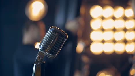 Retro-microphone-on-stage.-Silver-microphone-in-vintage-style