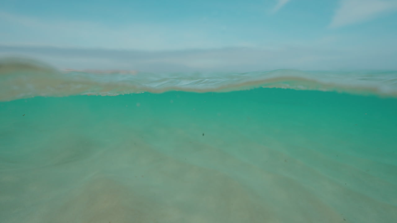 Underwater view of a calm beach scene