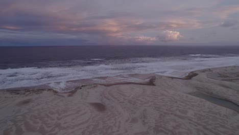 dramatic view of stockton sand dunes and beach near hunter river in new south wales, australia