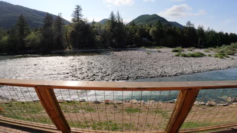 Skykomish-River-flowing-in-the-backyard-of-a-rural-cabin-with-a-back-porch